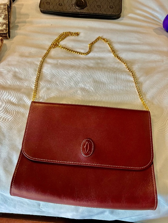 Cartier Handbags - Cartier Leather Clutch. Beautiful, burgundy. New.  Can be used as shoulder bag.